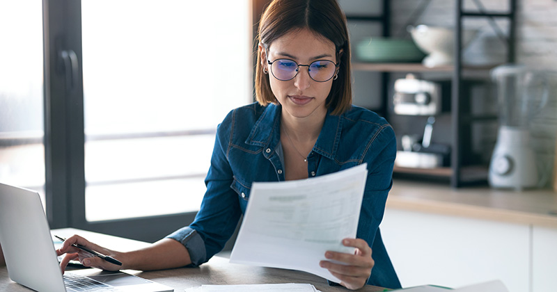 Woman Researching and Practicing Writing Invoices