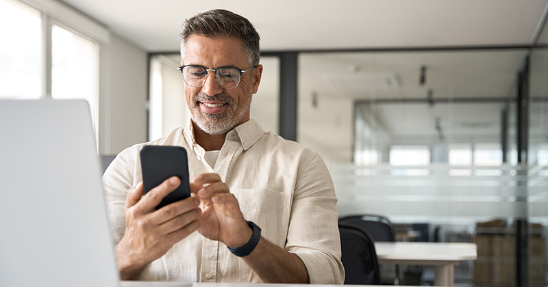 Middle aged pest control business owner on phone