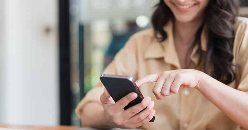 Young woman on phone searching for the best accounting service