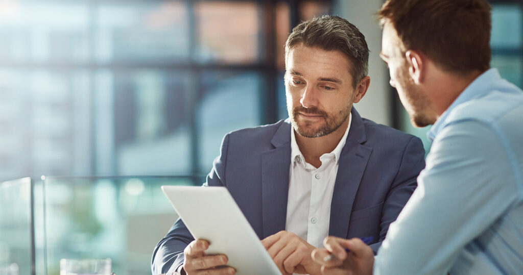 Male Business coach helping male business owner