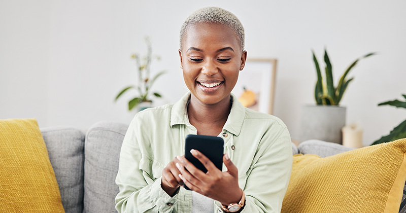 Smiling woman on smart phone