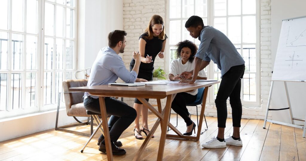 Business meeting between four coworkers