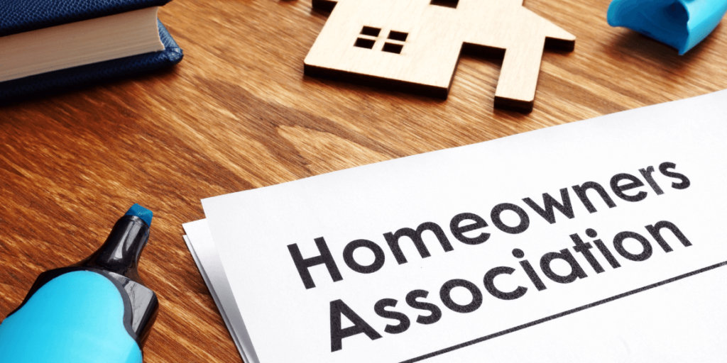 Documents about Homeowners Association (HOA) on a desk.